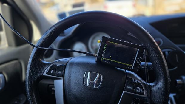 tinySA spectrum analyzer installed on a steering wheel