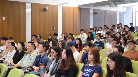 lecture hall full of students paying attention
